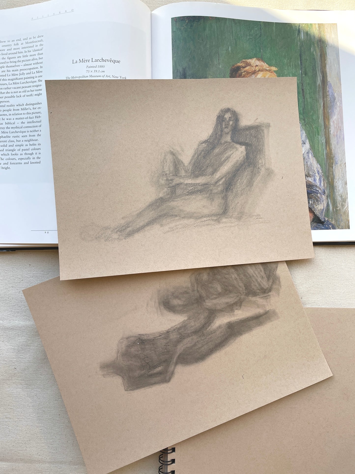 Introspective woman portrayed in graphite pencil on beige paper