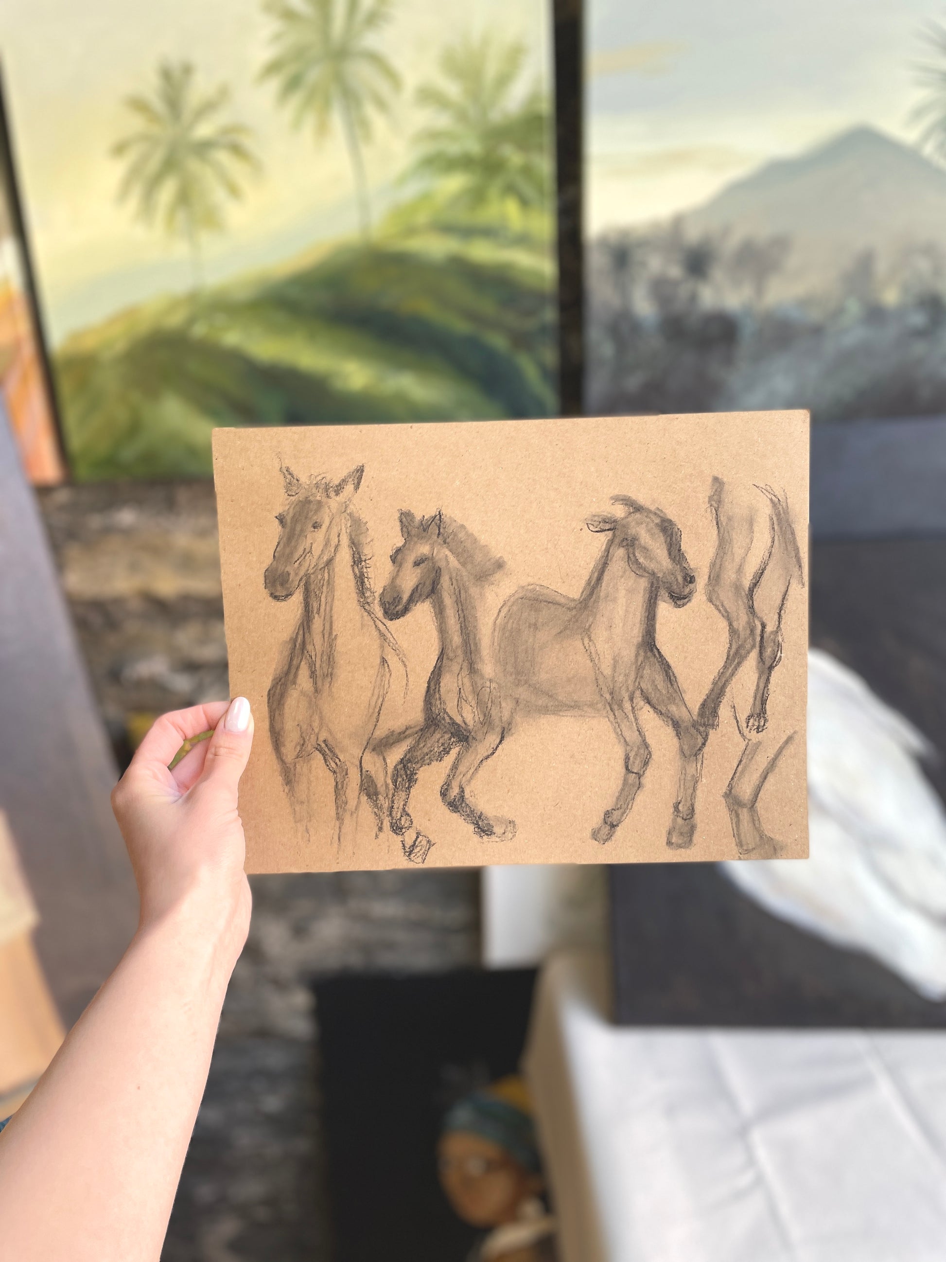 Hand-drawn horses in action on brown craft paper