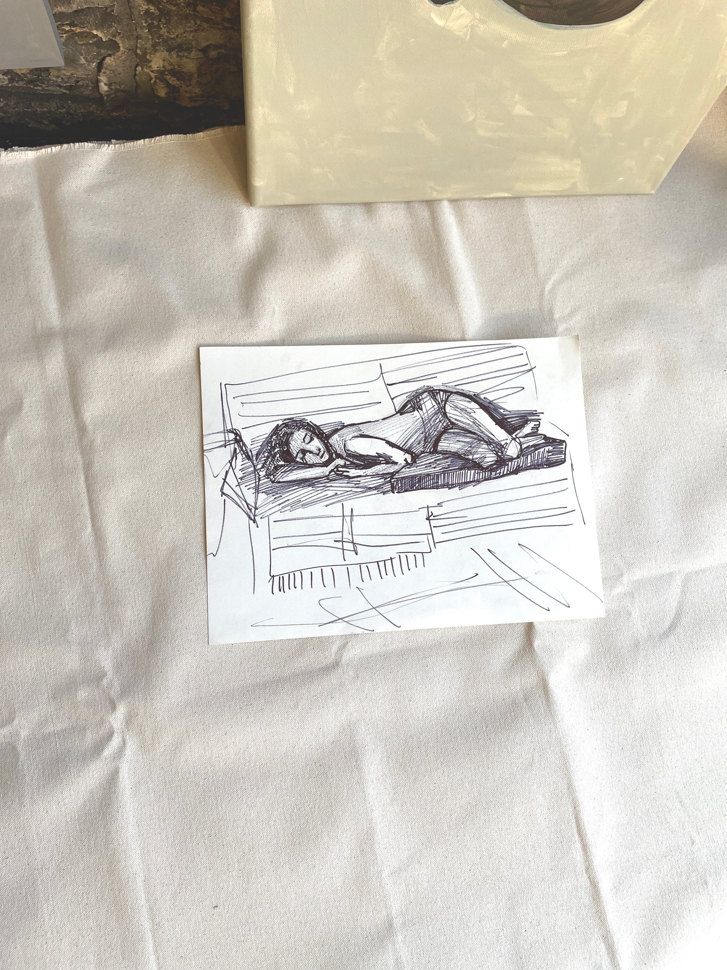 Black marker sketch of a woman sleeping