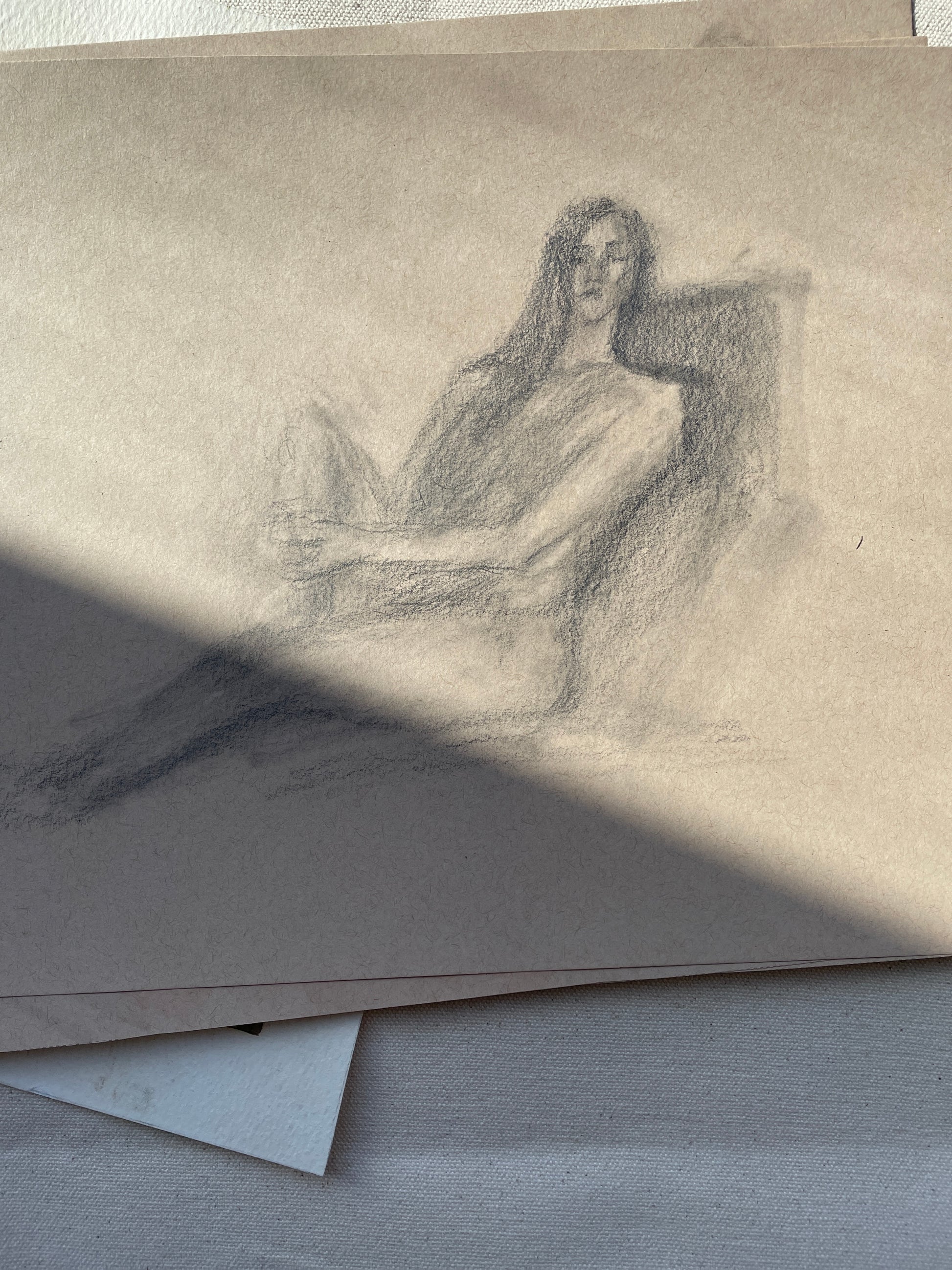 Sketch art of a seated woman with graphite pencil